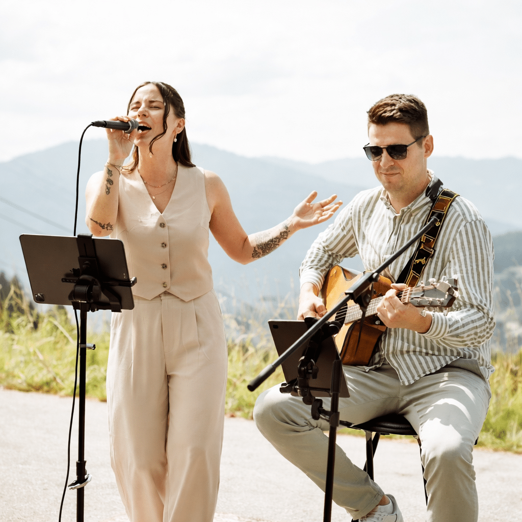 A_digital_photograph_captures_a_live_acoustic_duo_